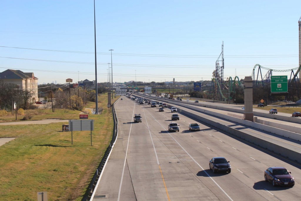 I-30 looking east toward SH 360 with moderate traffic.