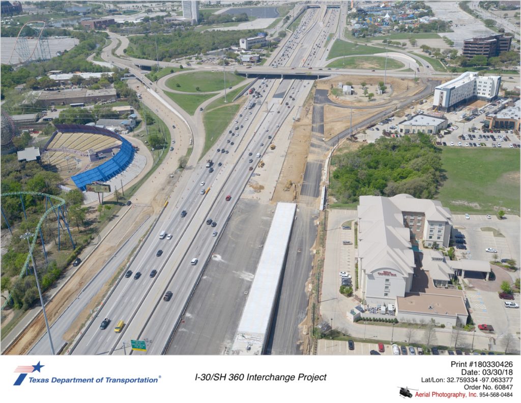 Aerial photograph taken March 2018 over I-30 direct connector flowing from SH 360 south to I-30 west. Construction of the westbound collector distributor and construction of Ballpark way exit.