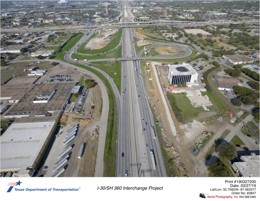 I-30 looking west with Six Flags Drive interchange in mid-ground.