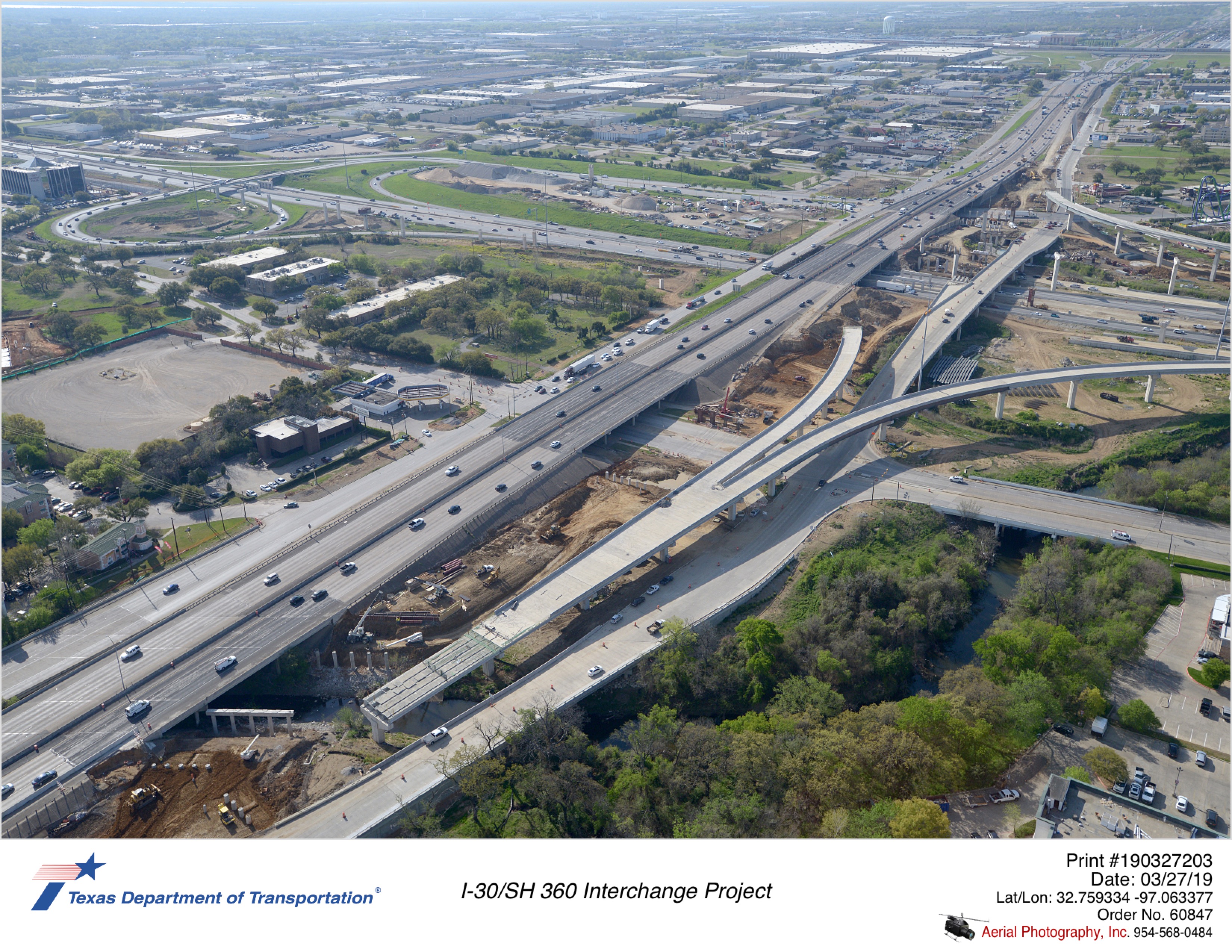 I-30/SH 360 interchange looking southwest with Lamar Boulevard and southbound bound frontage road intersection in mid-ground.