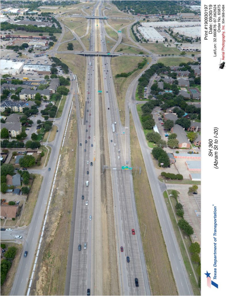 SH 360 looking north at Arkansas Ln and Pioneer Pkwy interchanges. Construction of interior lanes in median is shown.