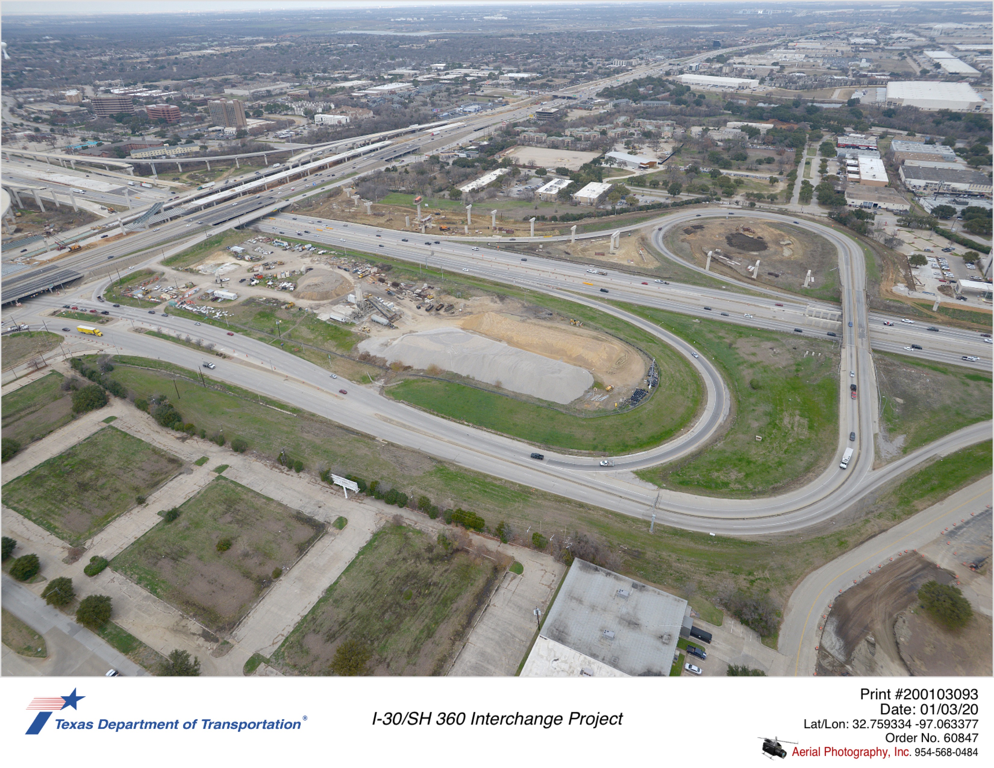 I-30/SH 360 interchange looking northwest. Construction of direct connector ramp substructures is shown on the north side of I-30.