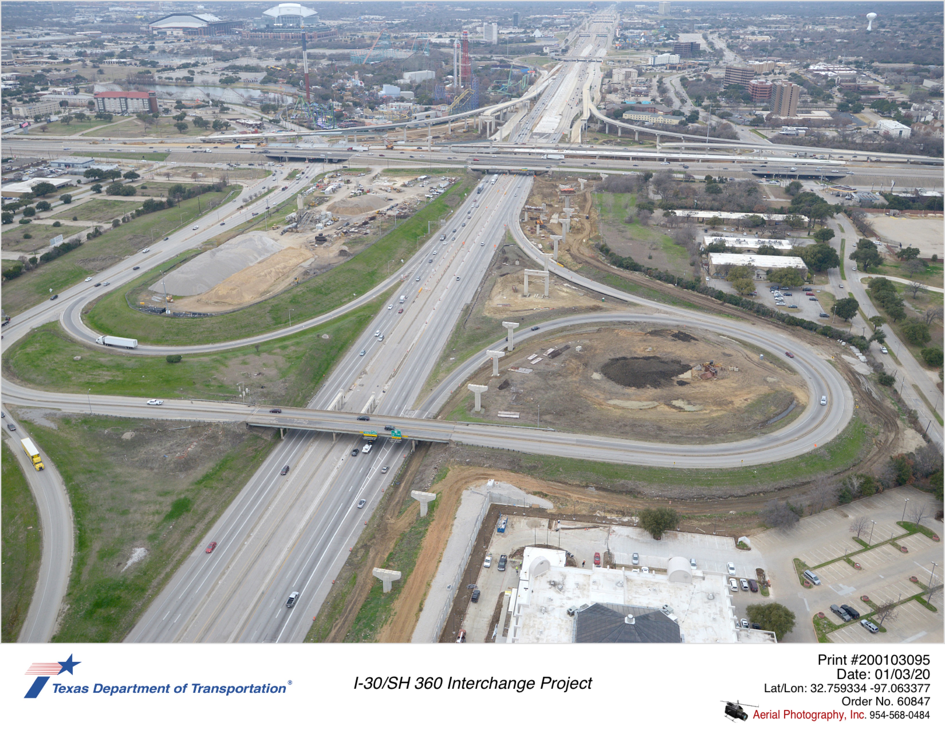 I-30 looking west at I-30/SH 360 interchange. Construction of westbound direct connector substructures is shown on north side of I-30.