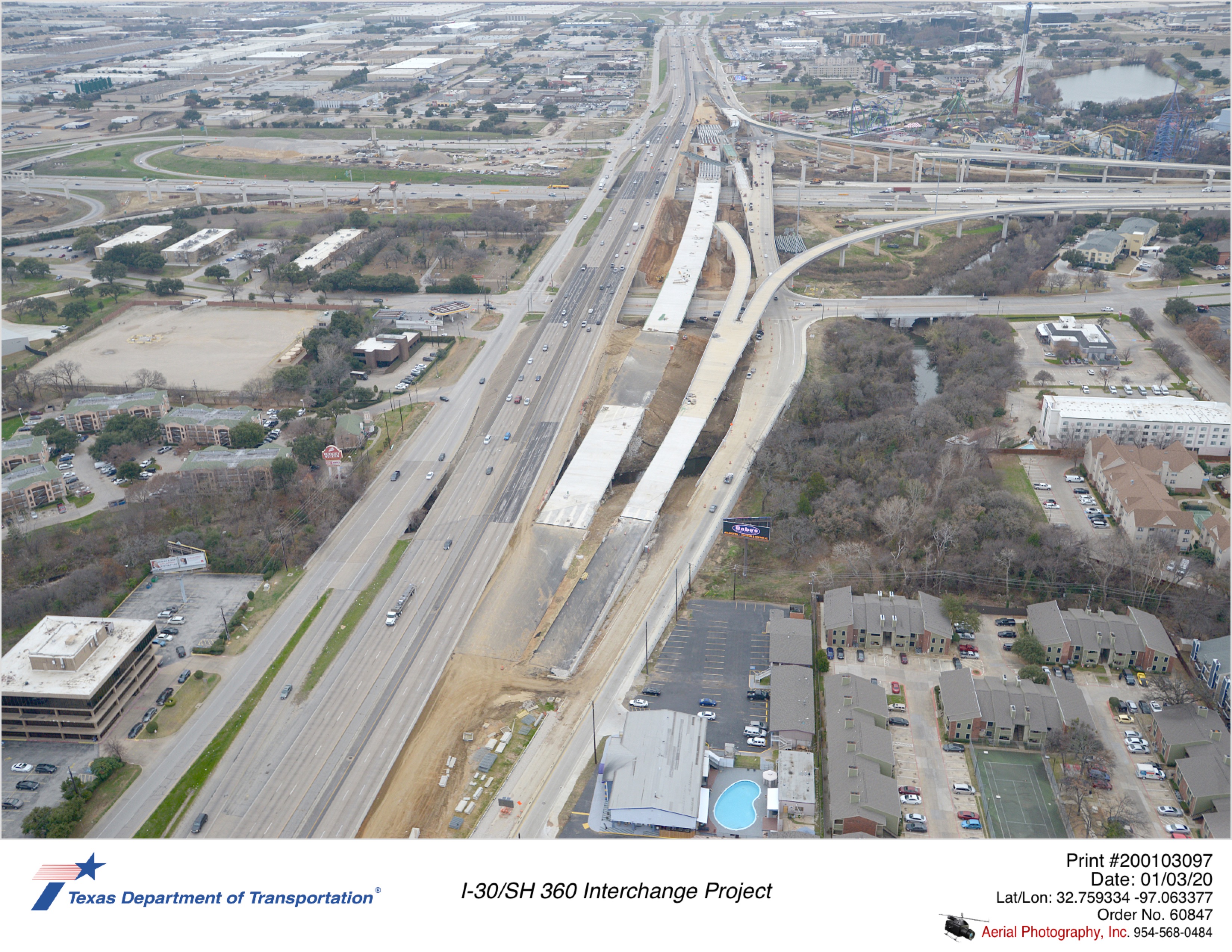 SH 360 looking south with I-30 crossing in background. Construction shows work on SH 360 southbound mainlane bridge.