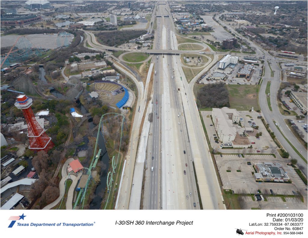 I-30 looking west at Ballpark Way interchange in background. Shows construction of Copeland Rd between Ballpark Way and Johnson Creek and new westbound exit to Copeland Rd.