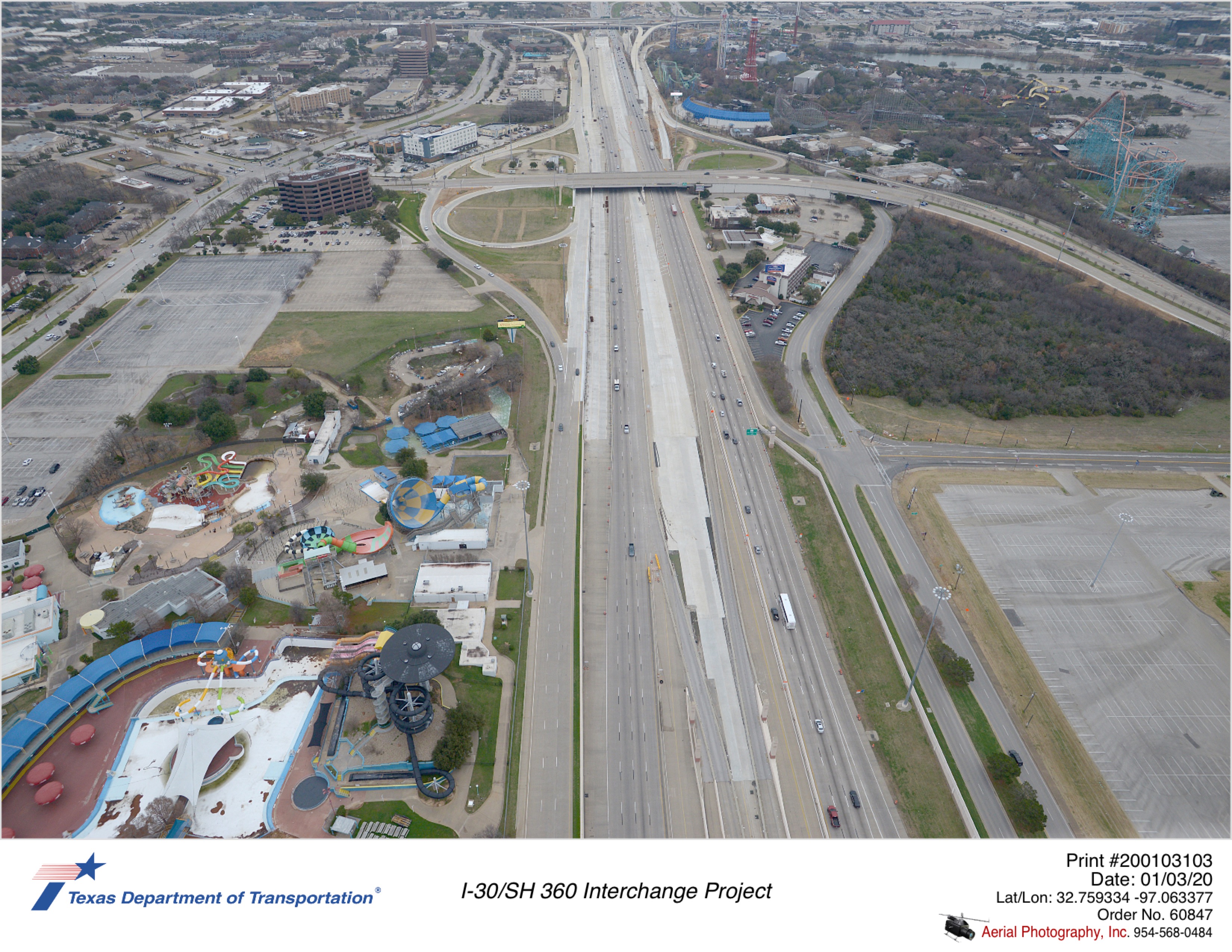 I-30 looking east over AT&T Way/Baird Farm Rd with Ballpark Way interchange in mid-ground. New pavement seen in median where managed lanes will be located.
