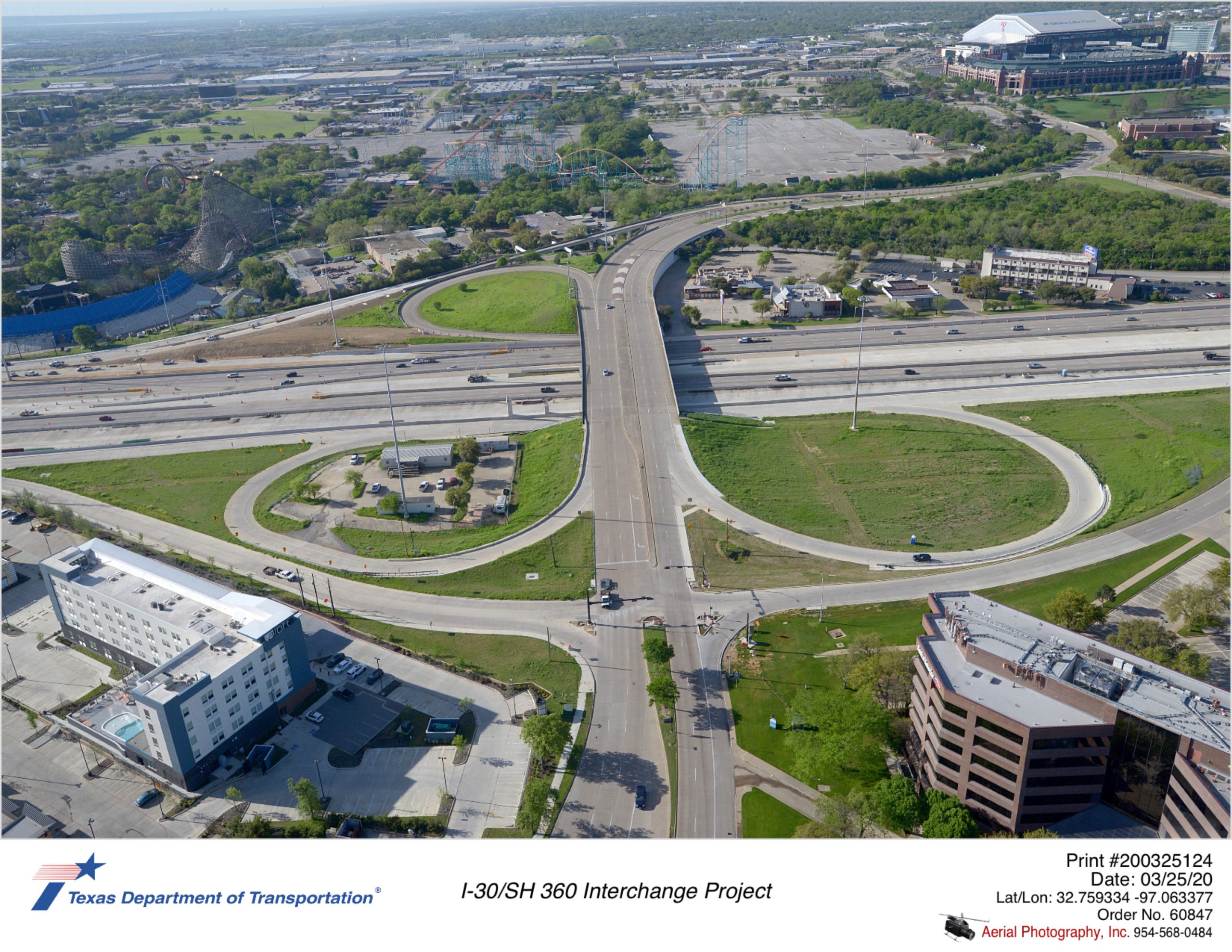 Ballpark Way interchange looking south with I-30 running left and right in mid-ground. Completed