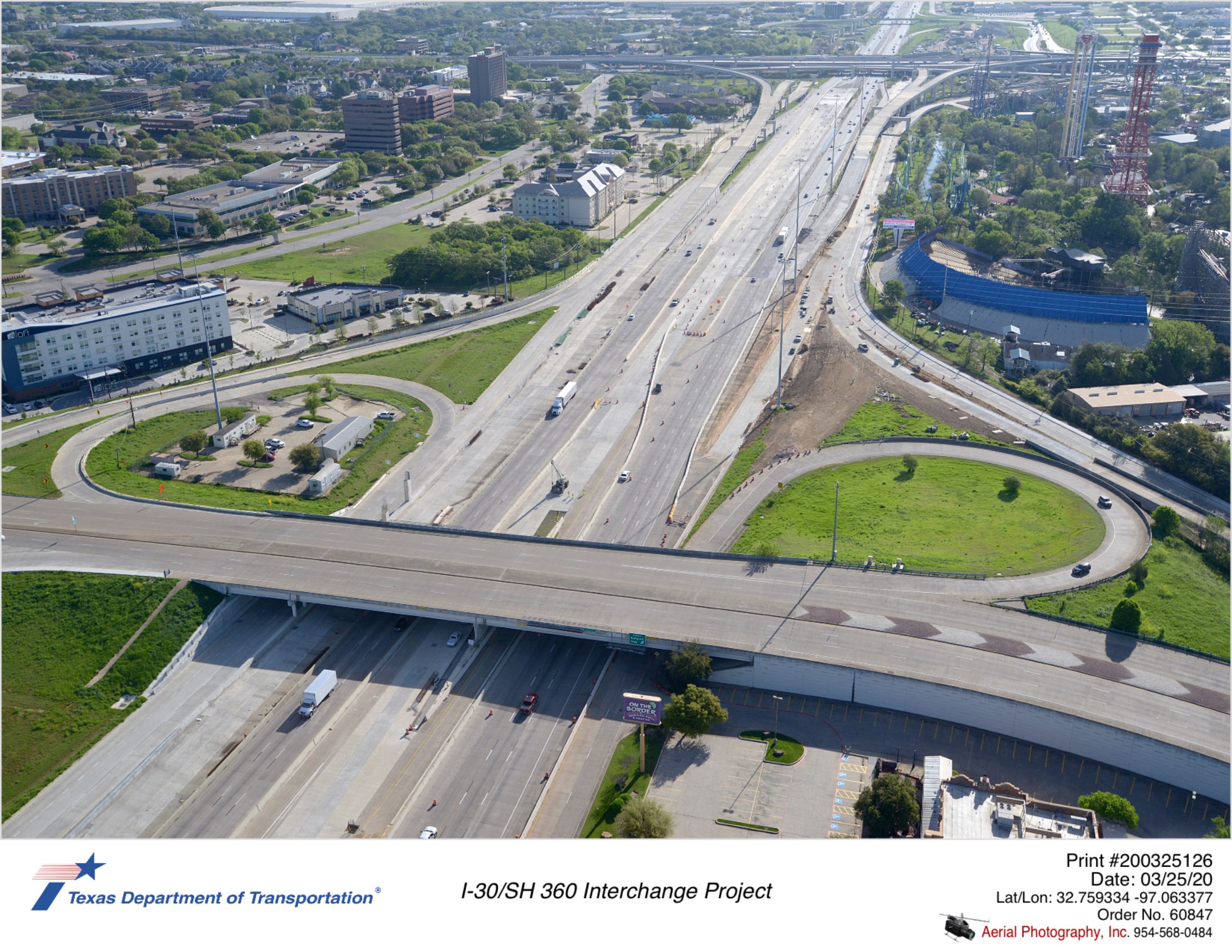 I-30 looking east over Ballpark Way interchange. Construction for new eastbound Copeland Rd exit and northbound ramp from Ballpark Way is shown.