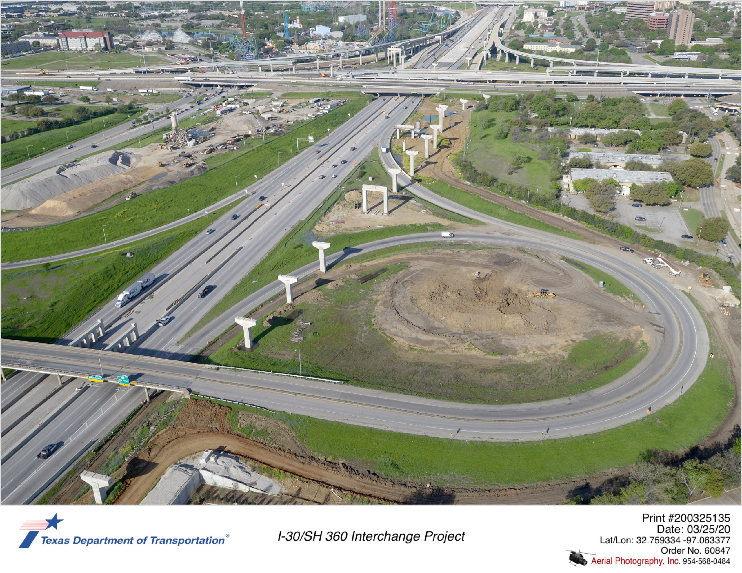 Six Flags Dr interchange with I-30 looking southwest. Bridge substructures for future westbound direct connectors to SH 360 shown along north side of I-30.