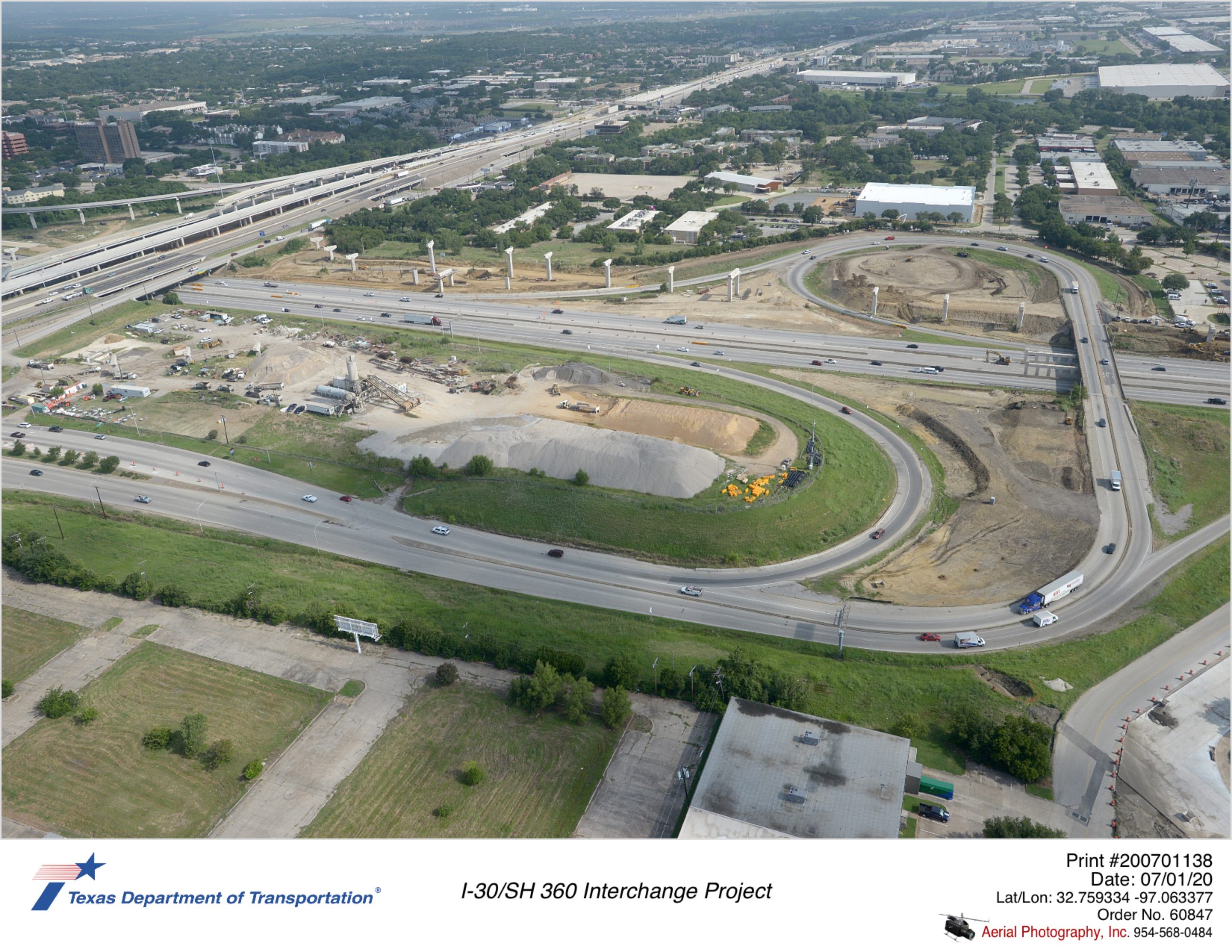 Looking northeast at I-30/Six Flags Dr interchange. Construction on west side of Six Flags Dr crossing of I-30 shown.