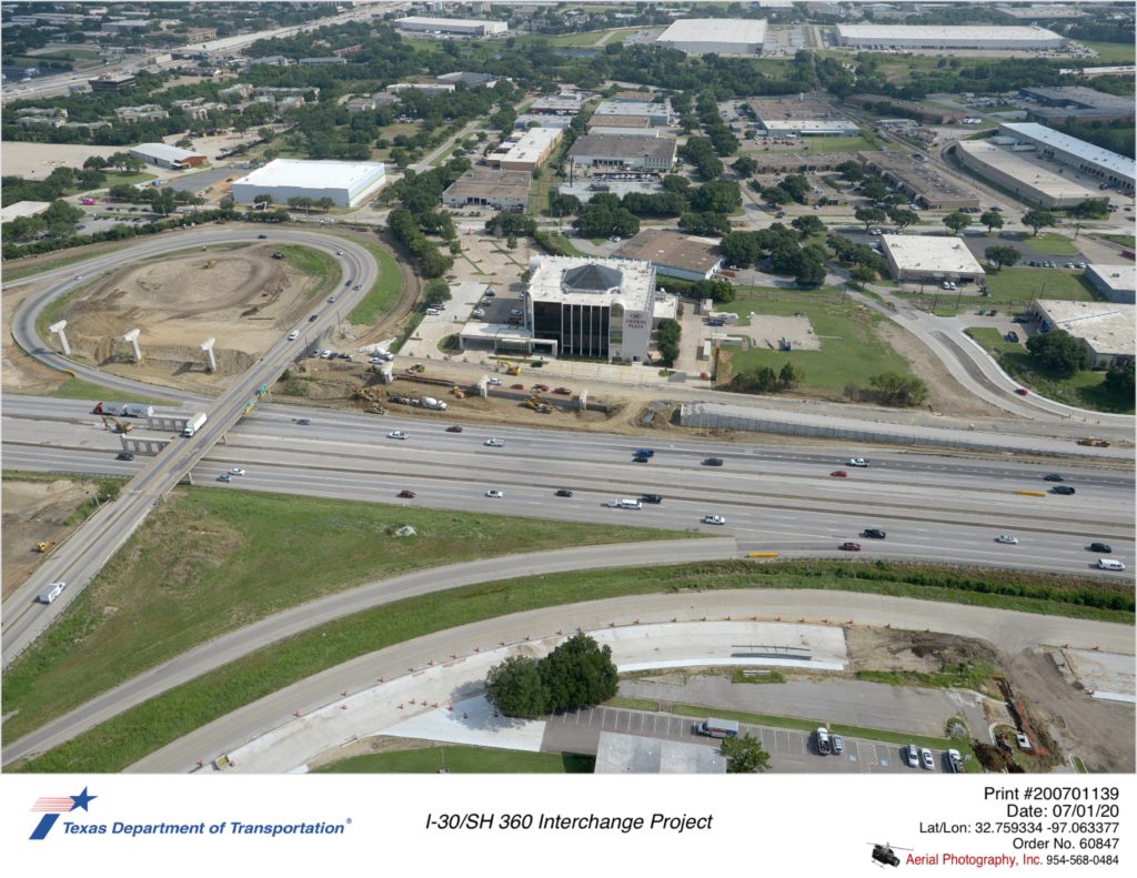 Looking north at Six Flags Dr crossing I-30. Construction of new westbound exit ramp approach to Six Flags Dr shown.