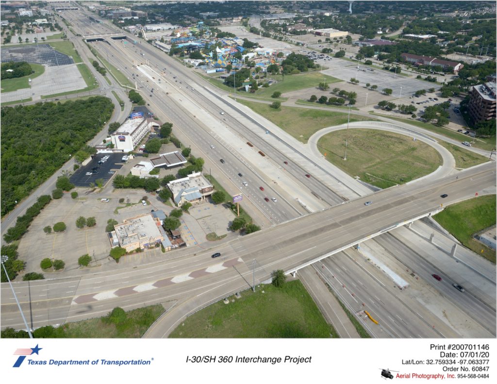 Looking northwest at I-30/Ballpark Way interchange. Completion of westbound connection to southbound Ballpark Way and to westbound frontage road shown.