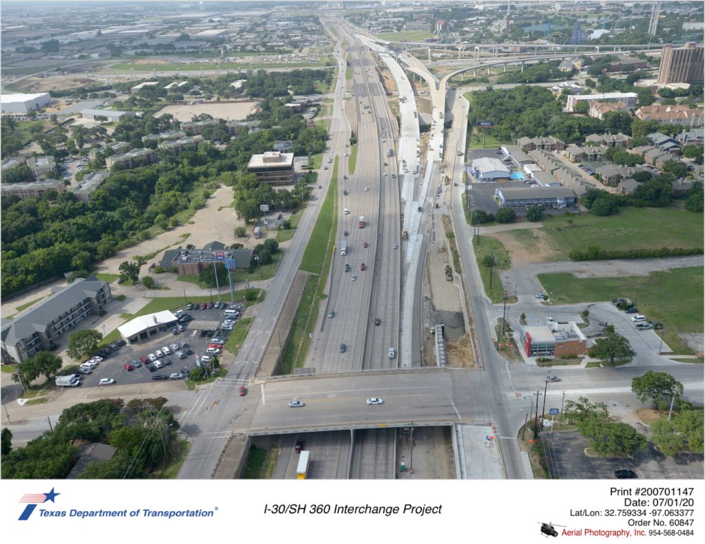 Looking south at SH 360/Ave J interchange. Construction of new southbound mainlane and connector approach shown.