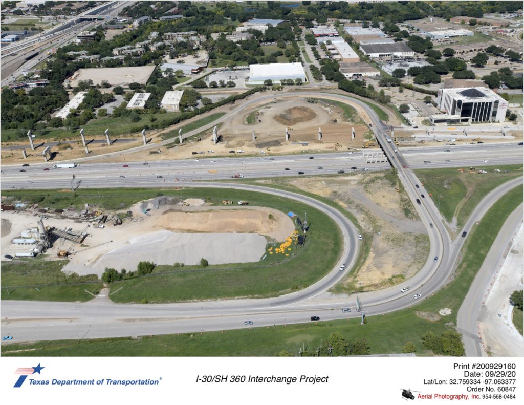 I-30/Six Flags Dr interchange. Construction activity shown on north side of I-30 with construction of new westbound direct connector to north and south SH 360.