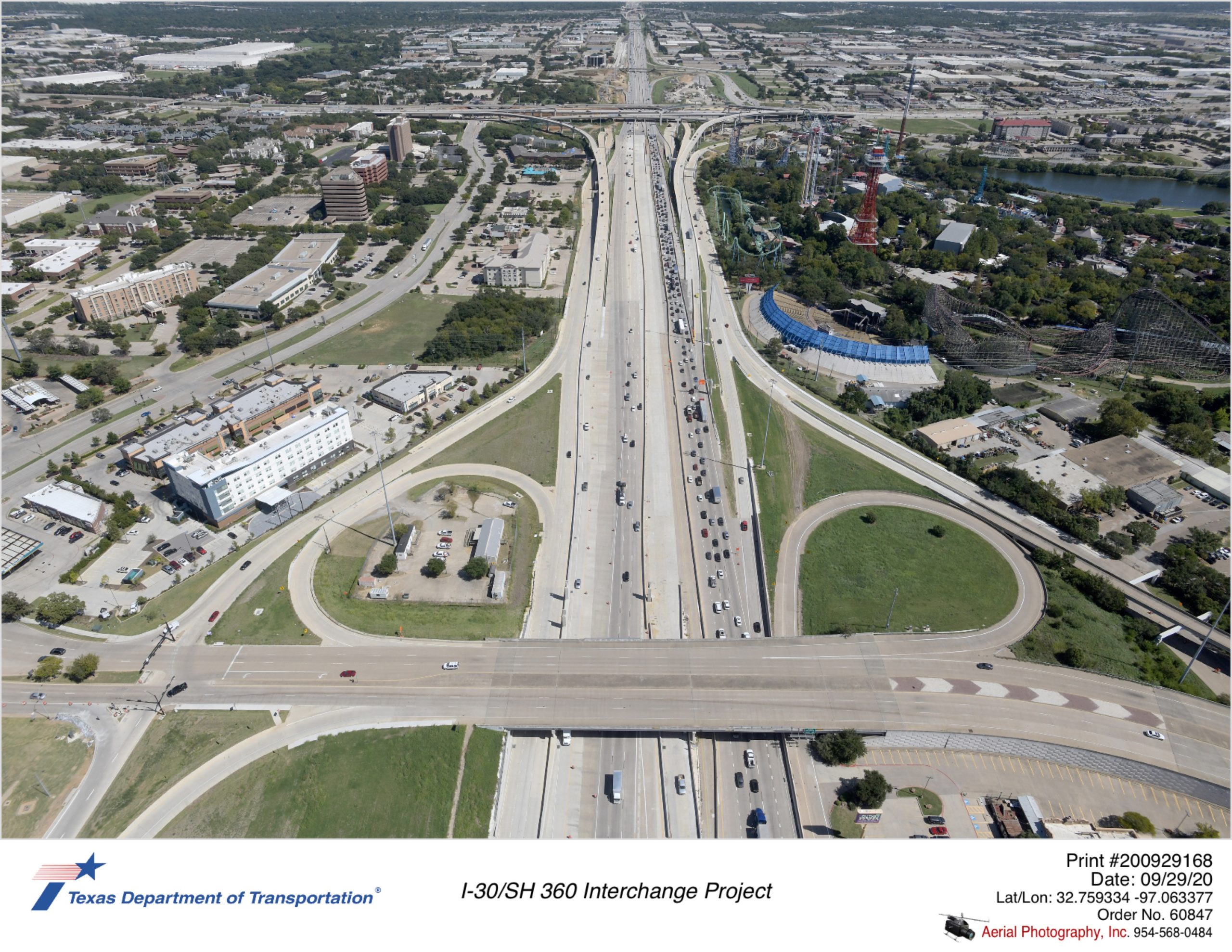 I-30 looking east with Ballpark Way interchange in foreground. Shows new eastbound exit to Six Flags Dr and direct connector ramps on west side of interchange.