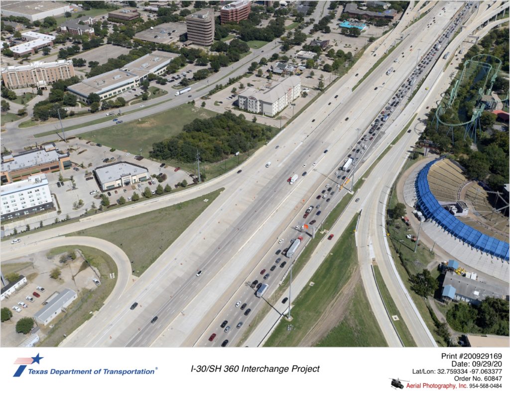 I-30 looking northeast over Ballpark Way interchange. Shows exit ramps for eastbound to Six Flags Dr and east-to-south direct connector.