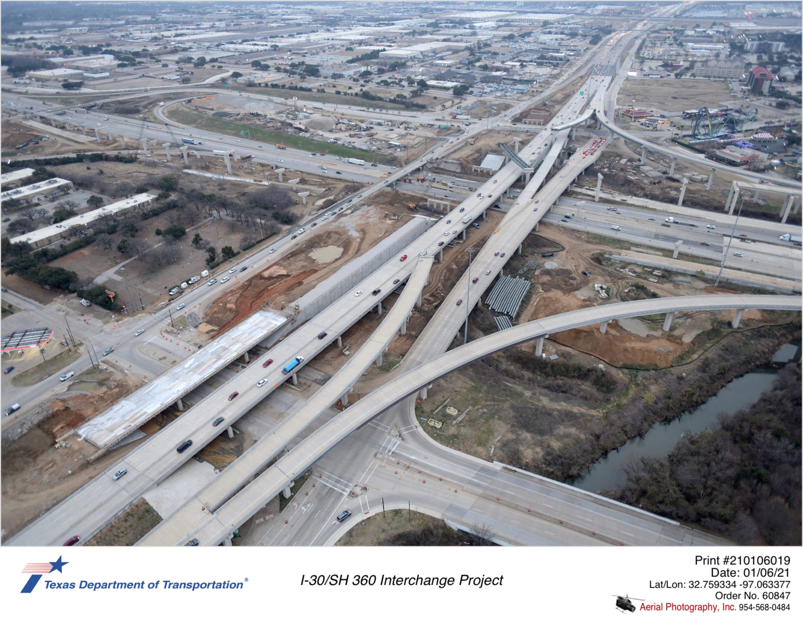 I-30/SH 360 interchange looking southeast over Lamar Blvd. Construction of new northbound mainlane bridges over Lamar Blvd and I-30 are shown.
