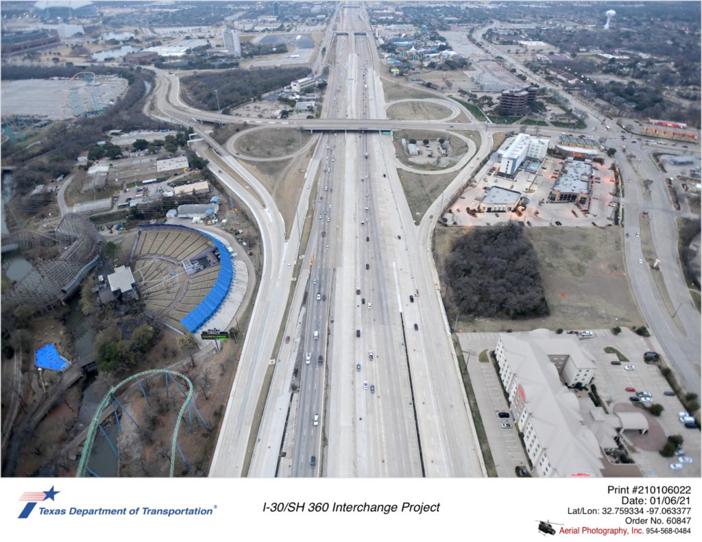 Over I-30 looking west with Ballpark Way interchange in mid-ground. Completed eastbound exit ramps to Copeland Rd/Six Flags Dr and the east-to-south direct connector are shown.