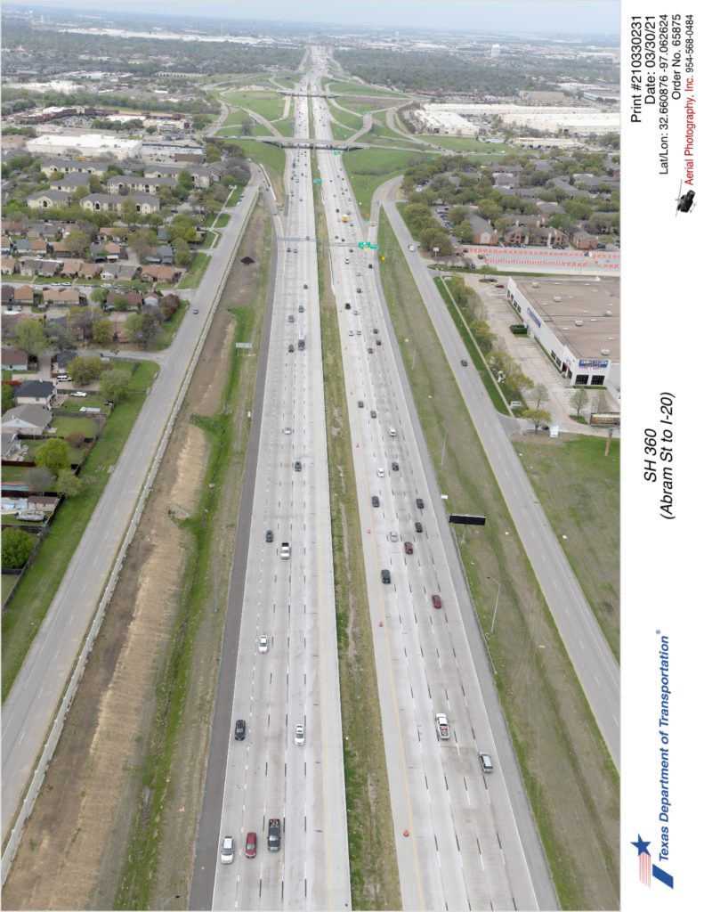SH 360 looking north over Mayfield Rd interchange. Completed interior lanes in use and completed sound wall construction on southbound frontage road.