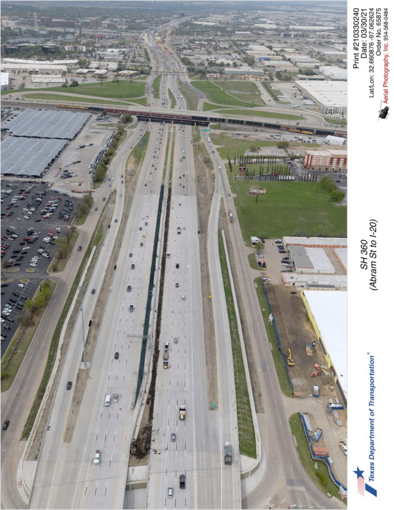 SH 360 looking north over Abram St interchange. Completed interior lane and access ramps north of Abram St in use.