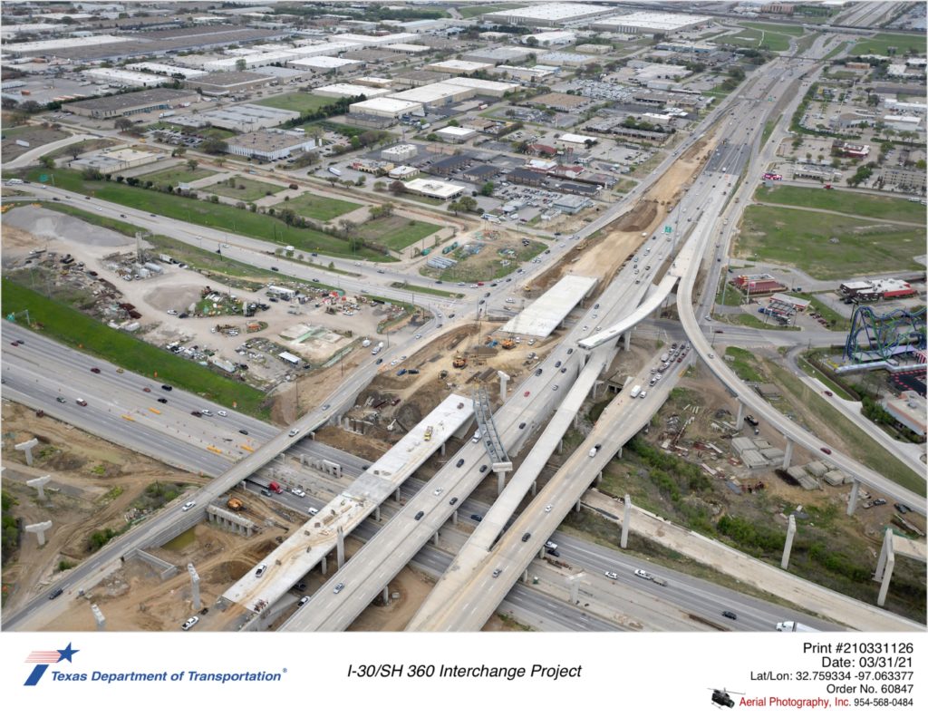 I-30/SH 360 interchange looking southeast. Focus on construction of new SH 360 northbound bridges for mainlanes and frontage road.