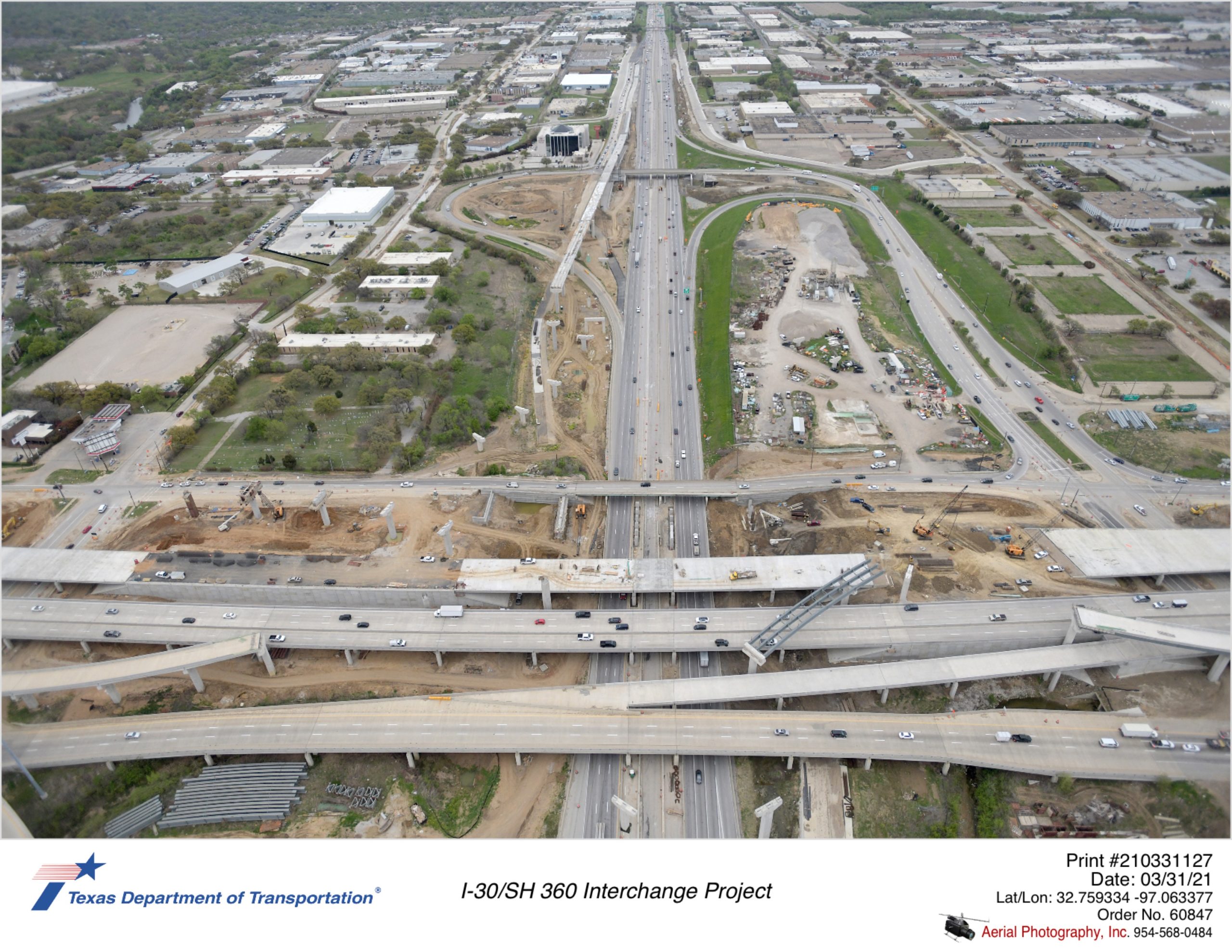 I-30 looking east over SH 360. Focus on SH 360 northbound construction and direct connector bridge construction in northeast quadrant.