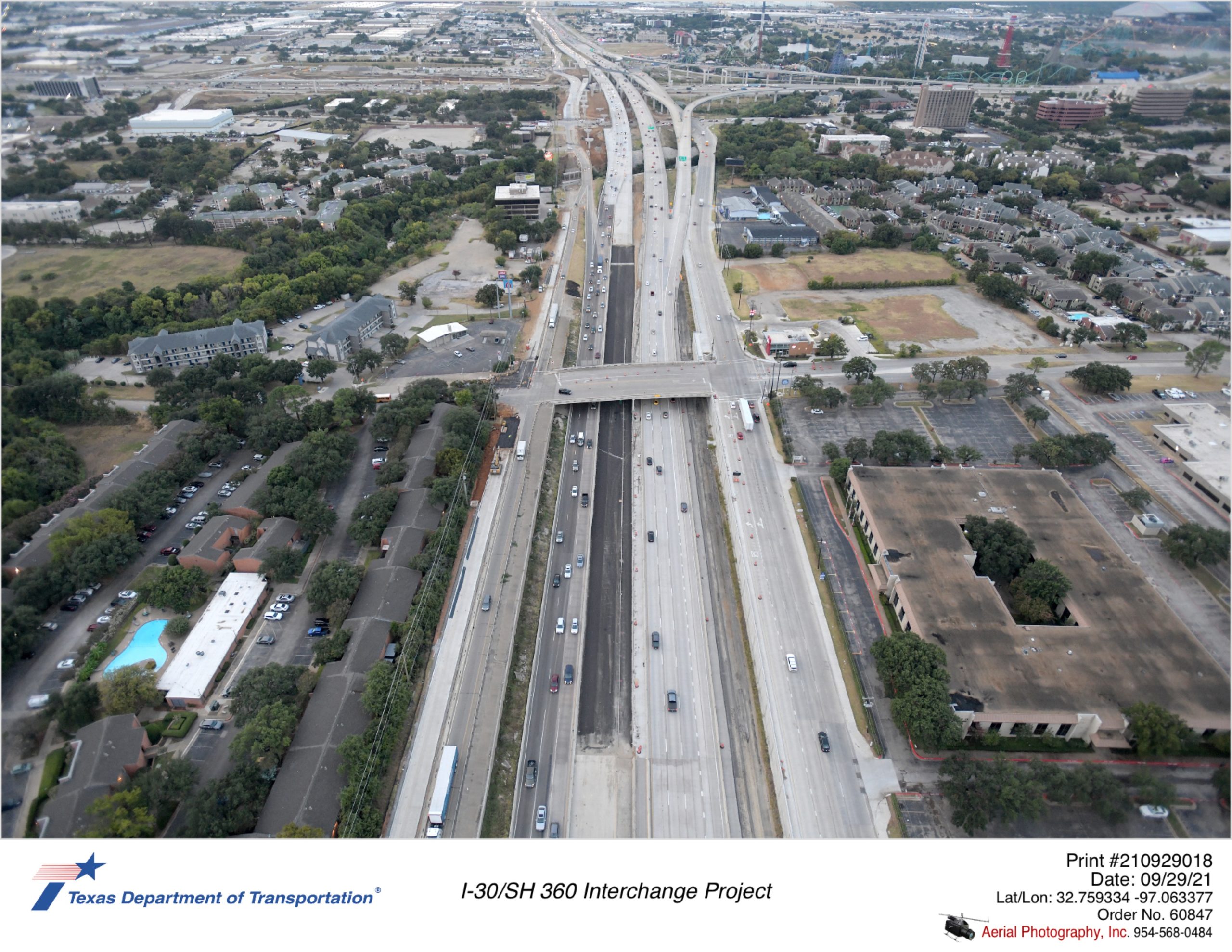 SH 360 looking south at Ave J interchange in midground. New northbound frontage road and mainlane construction shown.