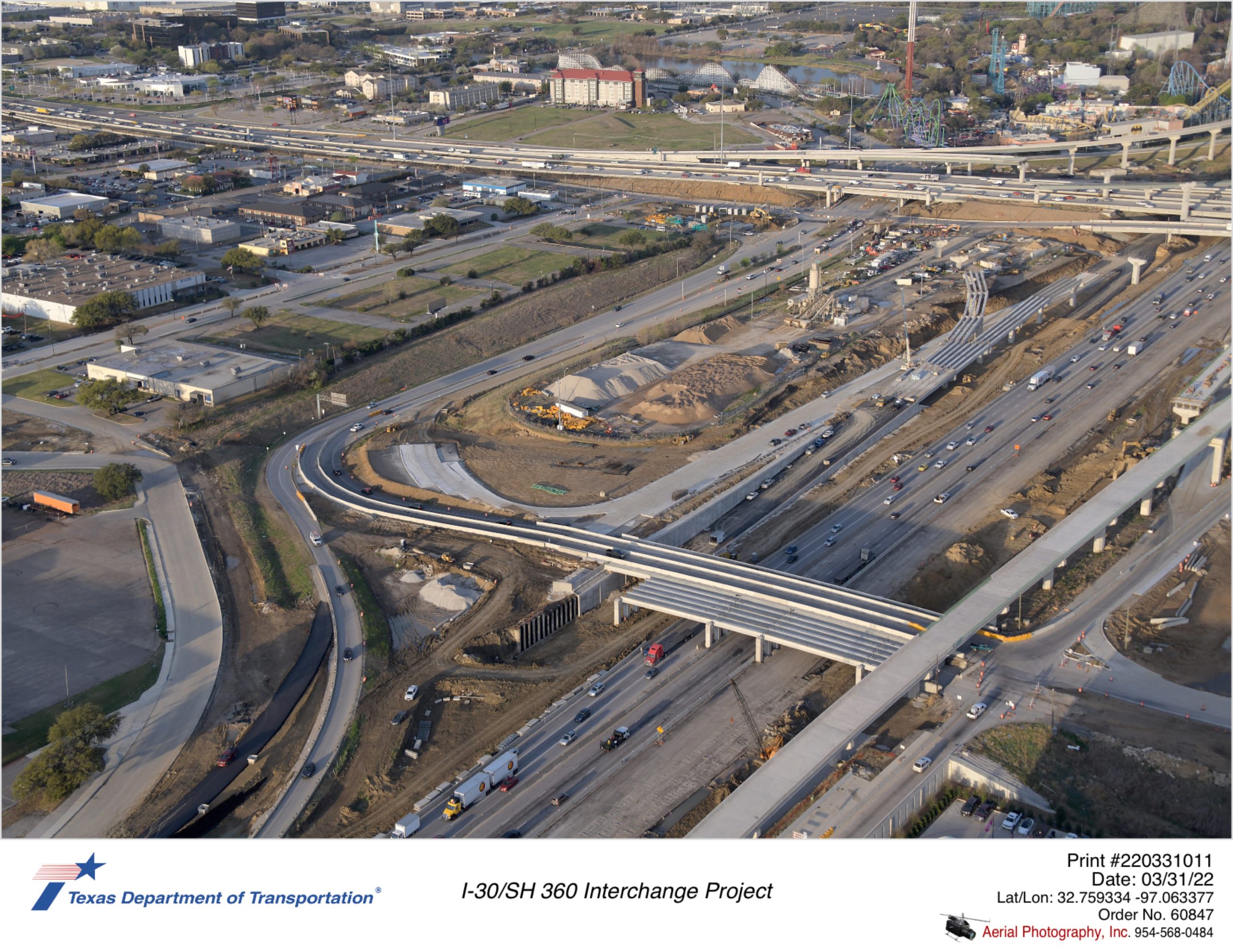I-30/Six Flags Dr interchange looking southeast. Progress shown for Six Flags Dr bridge construction on east side and eastbound frontage road construction up to Six Flags Dr.