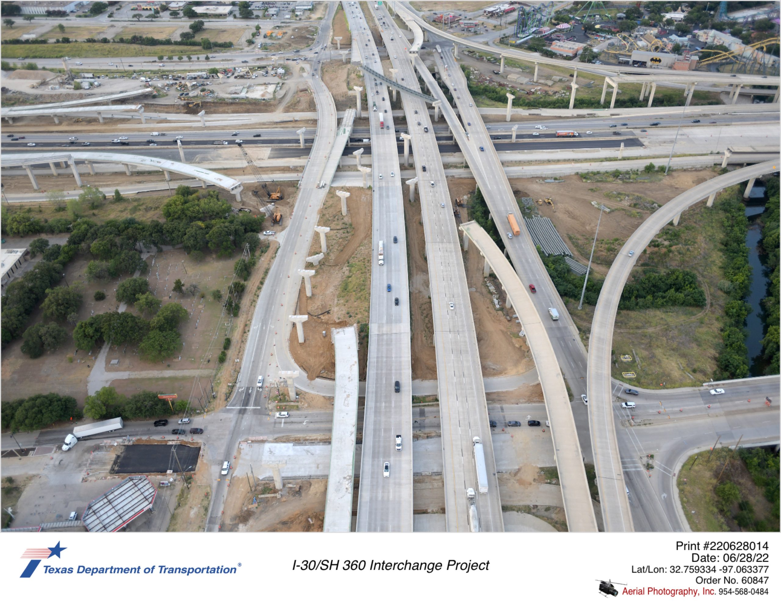 I-30/SH 360 interchange looking south over Lamar Blvd. Construction of westbound Lamar Blvd pavement and partially constructed direct connectors is shown.