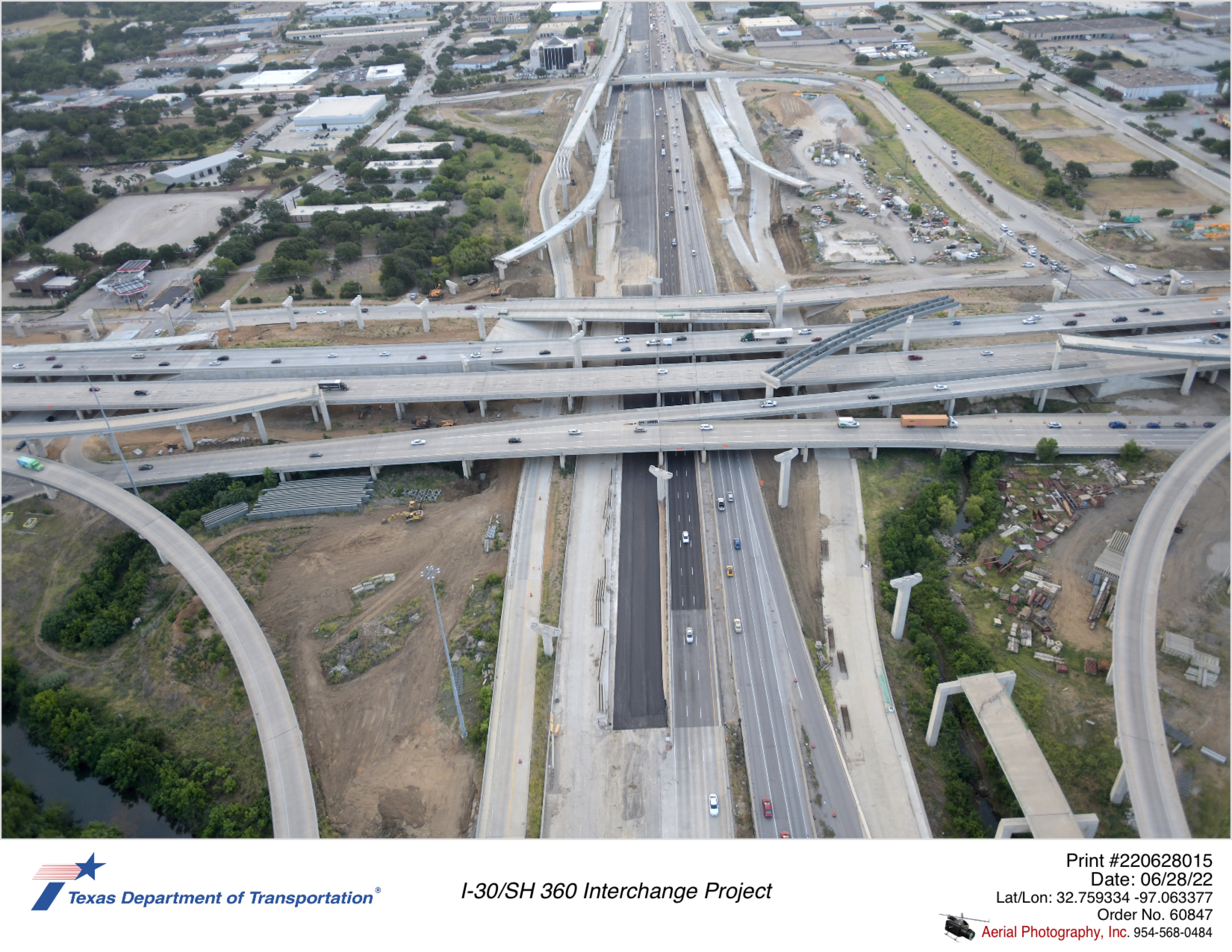 I-30/SH 360 interchange looking east. Image shows partially built direct connectors and construction of I-30 westbound permanent mainlanes.