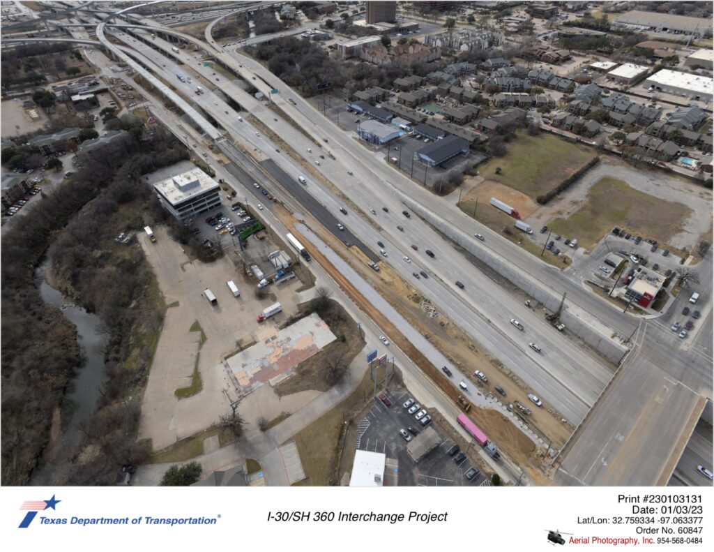 SH 360 looking southwest over Ave J interchange with I-30 interchange in background.