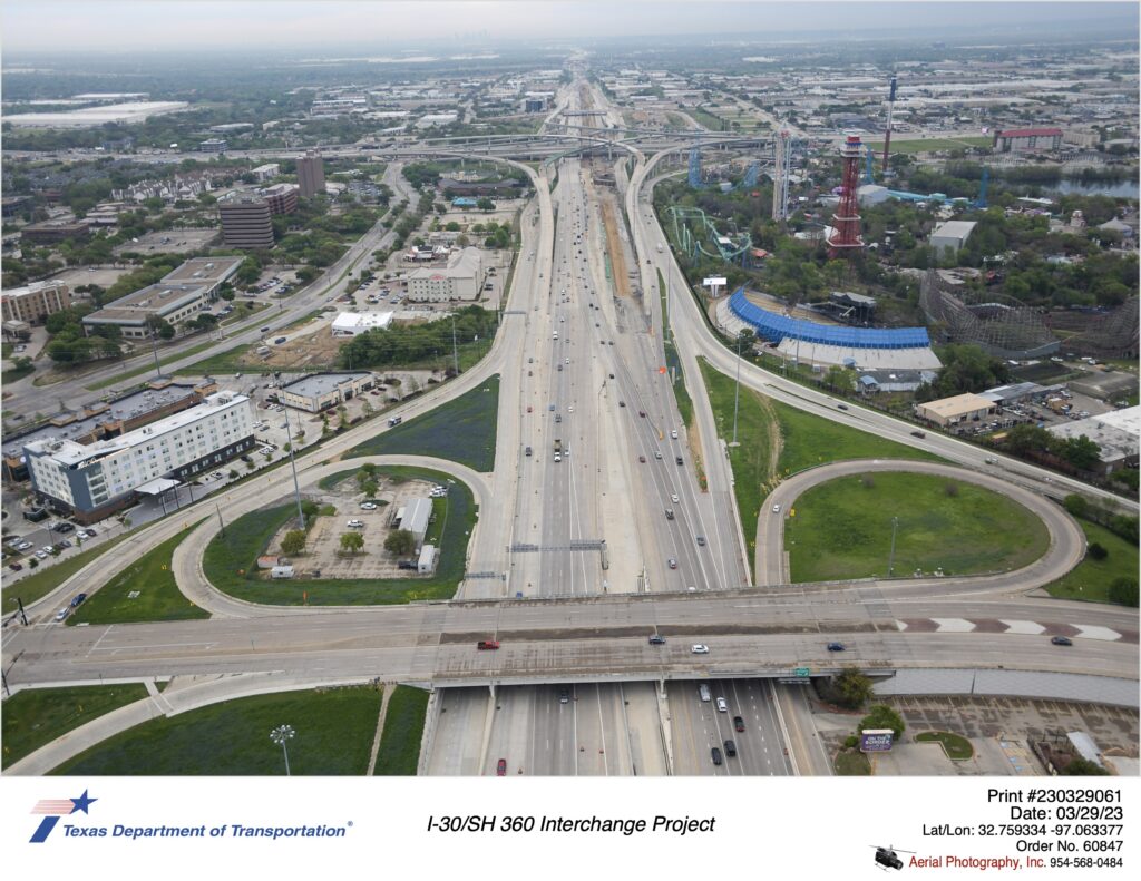 I-30 looking west over Ballpark Way interchange with SH 360 interchange in background. March 2023.