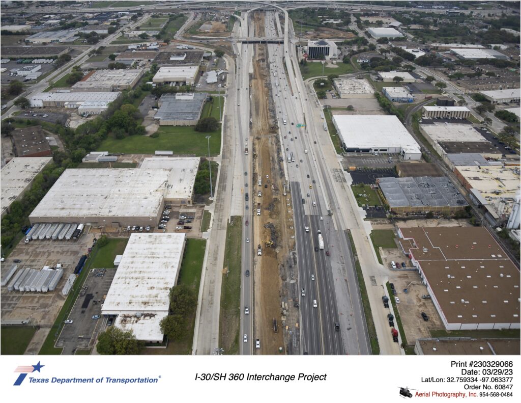 I-30 looking east at Six Flags Dr interchange. Construction of I-30 eastbound mainlanes shown. March 2023.