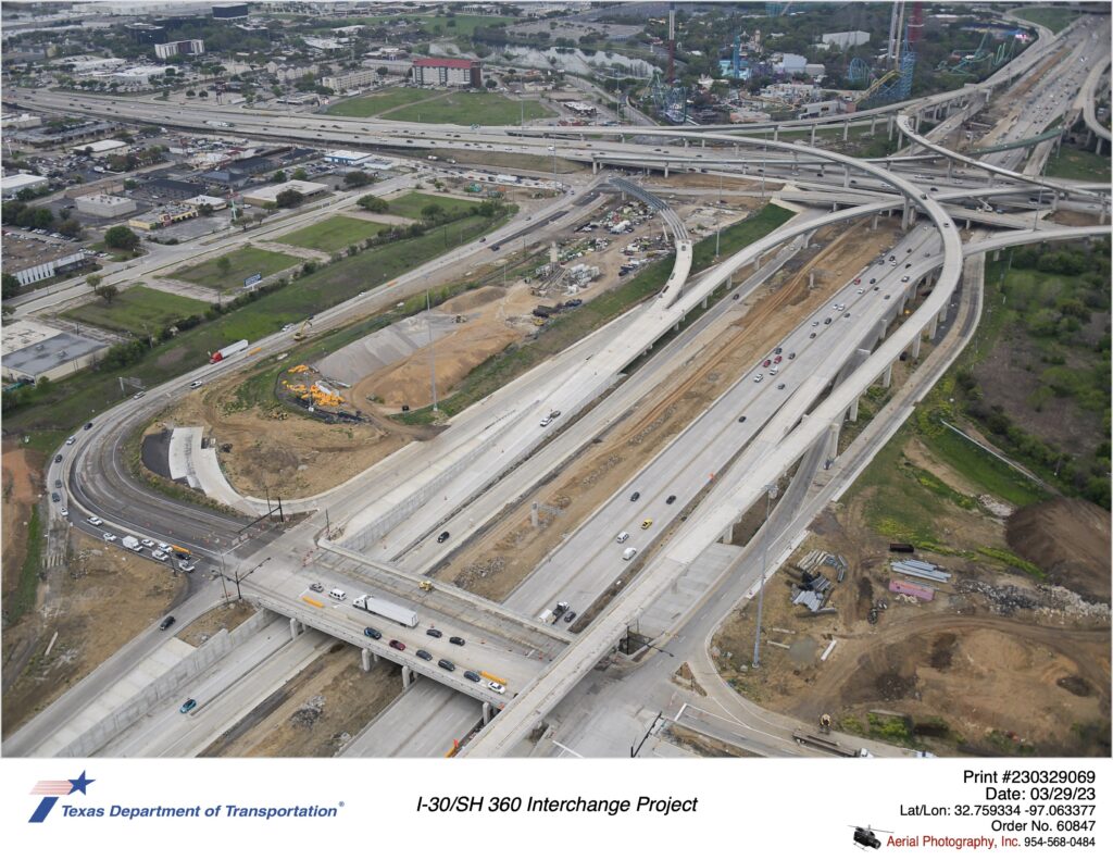 I-30 interchanges with Six Flags Dr and SH 360. Highlighting construction of Six Flags Dr south of I-30 and I-30 eastbound mainlanes. March 2023.