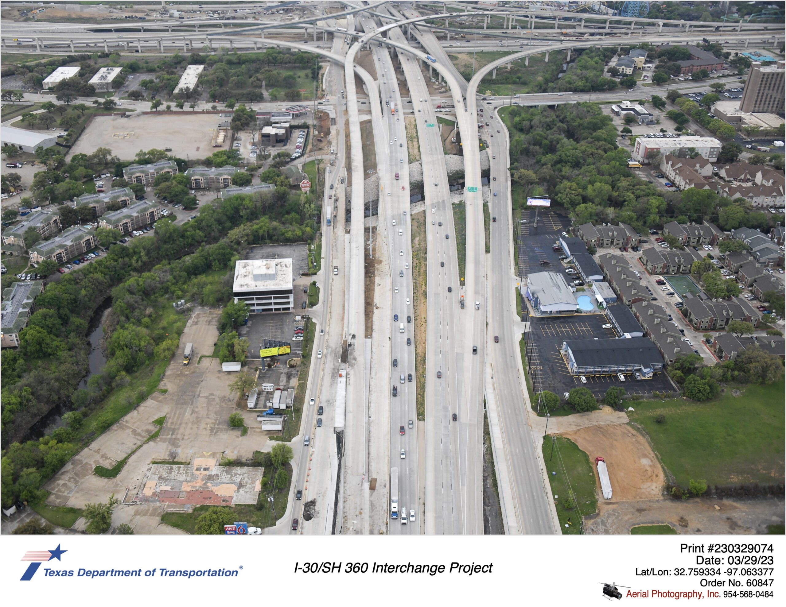 SH 360 looking south over Ave J at Lamar Blvd interchange highlighting northbound frontage road construction and direct connector ramp into SH 360. March 2023.