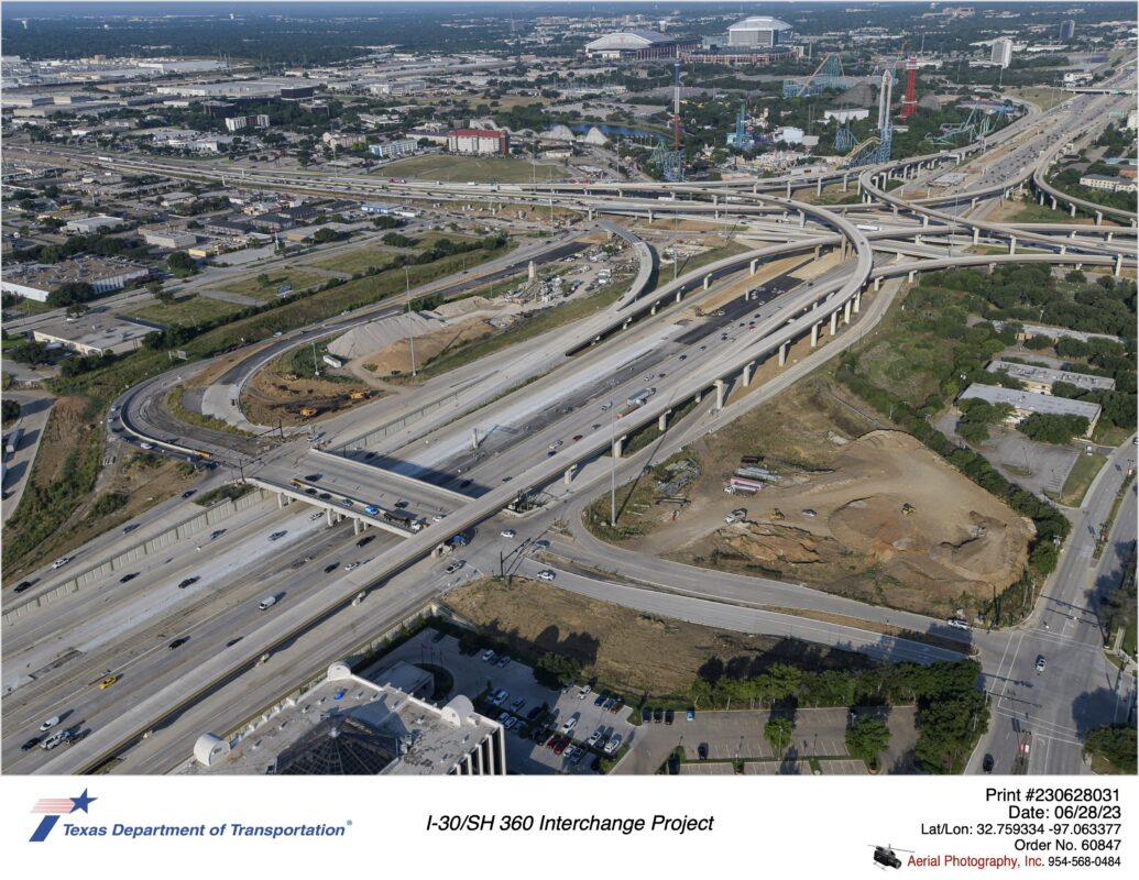 I-30 looking west over Six Flags Dr interchange. New eastbound pavement construction shown in photo.