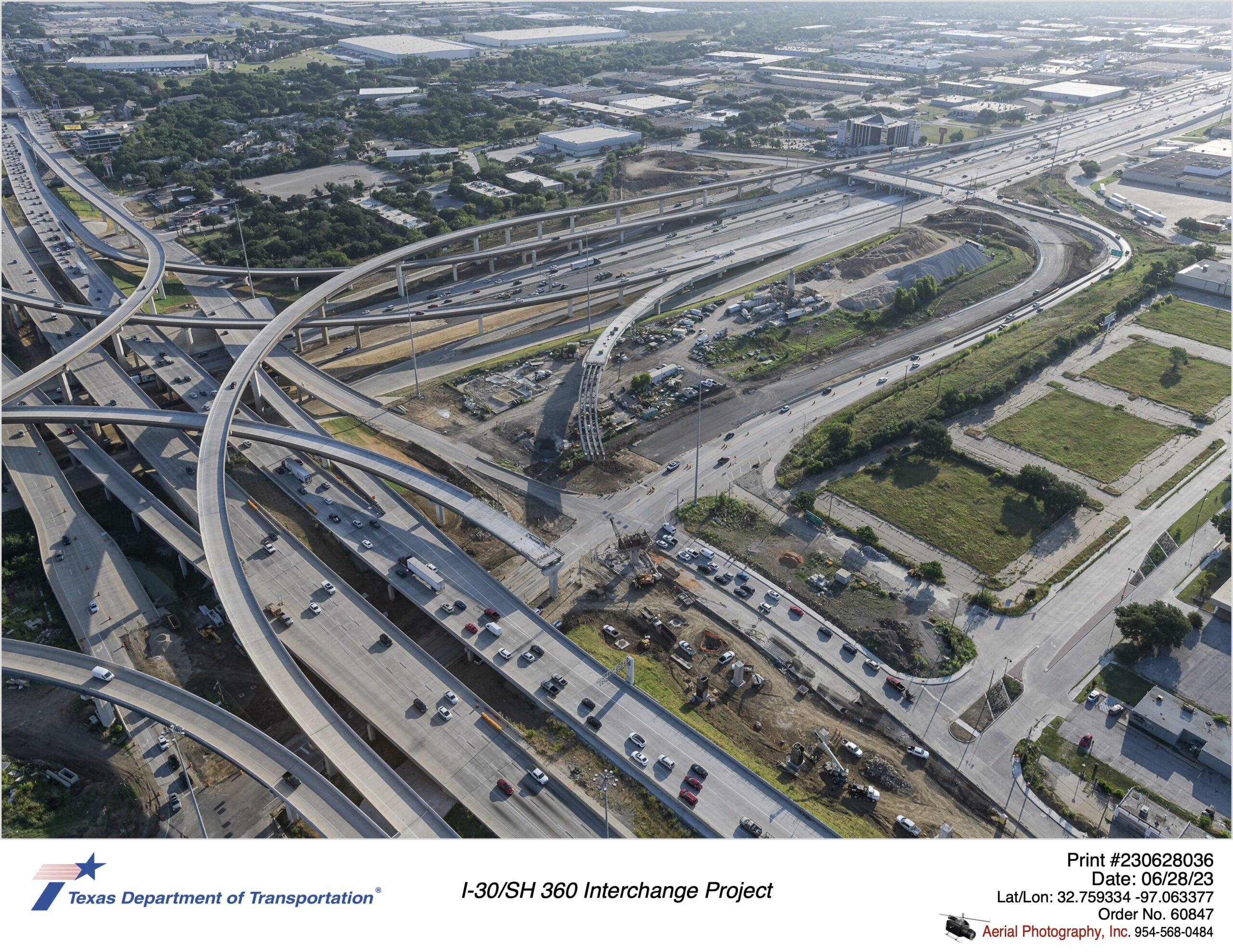 I-30 and SH 360 interchange looking northeast over Six Flags Dr interchange. Construction of new northbound direct connectors shown in image.