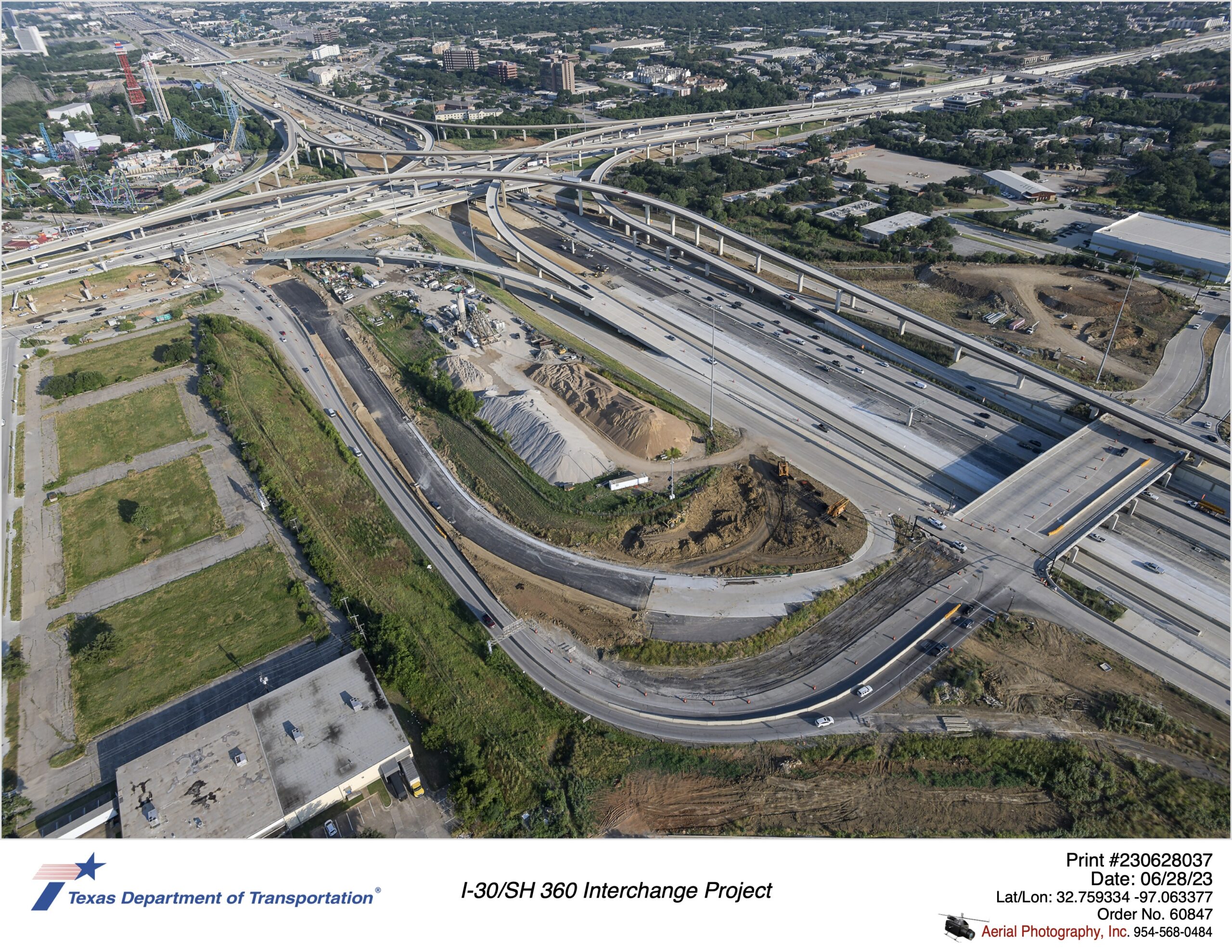 I-30 and SH 360 interchange looking northwest at Six Flags Dr connection between I-30 and SH 360. Image shows construction of eastbound mainlanes and Six Flags Dr.