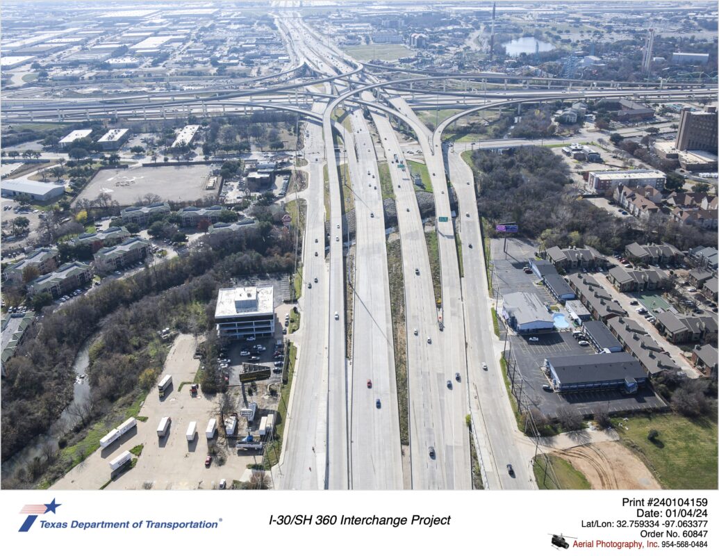 SH 360 looking south over Ave J at I-30 interchange with Johnson Creek crossing in mid-ground.