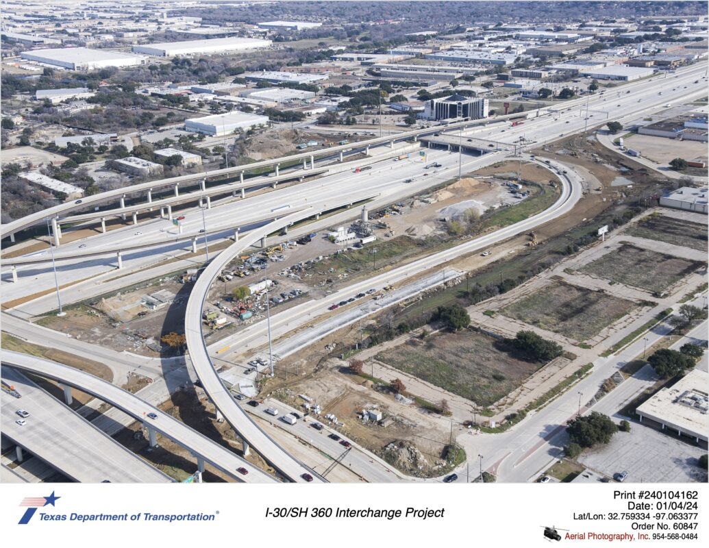 Six Flags Dr construction looking northeast. There is active construction of future eastbound lanes between SH 360 and I-30.