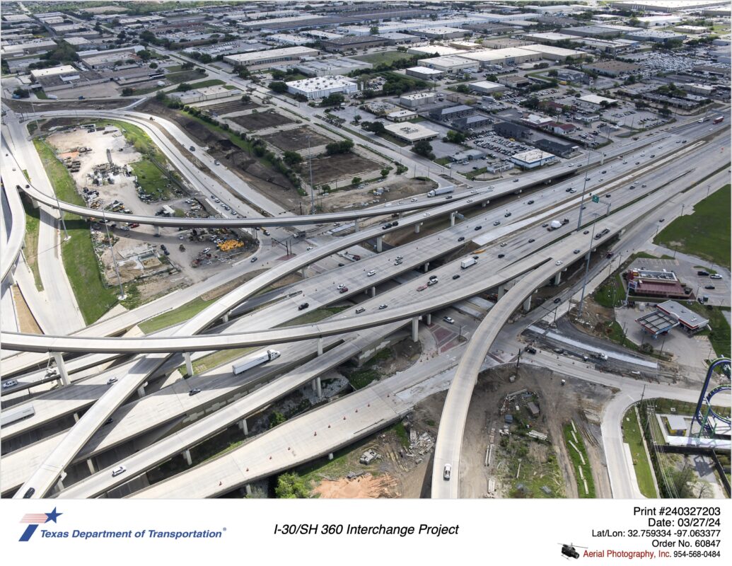 SH 360 interchange with Six Flags Drive. Active construction on Six Flags Drive between Copeland Road intersection on right side of photograph to 107th Street intersection near left side of photograph.